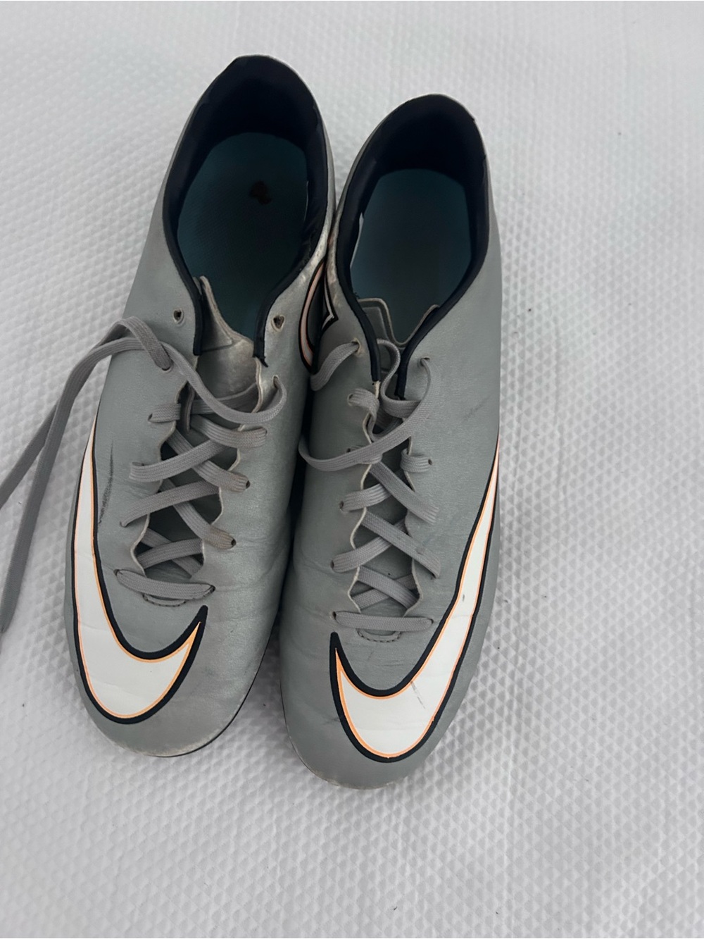 Nike Men’s Grey Athletic Soccer Cleats with White Swoosh and Black Trim